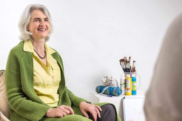 Stephanie Shochat-Gruss is sitting with a client doing a counselling session