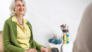 Stephanie Shochat-Gruss is sitting with a client doing a counselling session